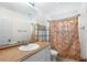 Bathroom with vanity, shower/tub combo and patterned curtain at 5 Loma Linda # 5, Lakeland, FL 33813