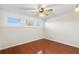 Bright bedroom with wood floors, ceiling fan, and multiple windows at 5 Loma Linda # 5, Lakeland, FL 33813