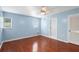 Bedroom with wood floors and ceiling fan, access to balcony at 5 Loma Linda # 5, Lakeland, FL 33813