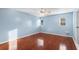 Bedroom with wood floors and ceiling fan, access to balcony at 5 Loma Linda # 5, Lakeland, FL 33813