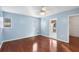 Bedroom with wood floors and ceiling fan, access to balcony at 5 Loma Linda # 5, Lakeland, FL 33813