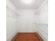Walk-in closet with wire shelving and wood floors at 5 Loma Linda # 5, Lakeland, FL 33813