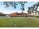 Community building near lake with tennis courts at 5 Loma Linda # 5, Lakeland, FL 33813