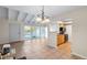 Open concept dining area with kitchen access and tile flooring at 5 Loma Linda # 5, Lakeland, FL 33813