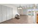 Dining area with tile floors, white closet doors, and a chandelier at 5 Loma Linda # 5, Lakeland, FL 33813