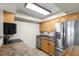Efficient kitchen featuring stainless steel appliances and wood cabinets at 5 Loma Linda # 5, Lakeland, FL 33813