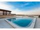 Inviting rectangular pool with lake view and blue sky at 5 Loma Linda # 5, Lakeland, FL 33813