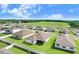 Aerial view of a community with houses and green space at 1125 Michelangelo Ln, Winter Haven, FL 33884