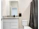 Clean bathroom with granite countertop, white cabinets, and shower at 1125 Michelangelo Ln, Winter Haven, FL 33884