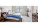Spacious bedroom with a king-size bed and wood-framed headboard at 1125 Michelangelo Ln, Winter Haven, FL 33884