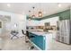 Stylish kitchen featuring teal accents and granite countertops at 1125 Michelangelo Ln, Winter Haven, FL 33884