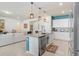 Open kitchen features a large island and breakfast bar at 1125 Michelangelo Ln, Winter Haven, FL 33884