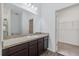 Bathroom with dark brown vanity and granite countertop at 3973 Spruce Creek Dr, Lakeland, FL 33811