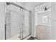 Clean shower with glass enclosure and neutral tile at 3973 Spruce Creek Dr, Lakeland, FL 33811