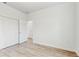 Bedroom with wood-look floors and built-in closet at 223 Stanley Ave, Frostproof, FL 33843