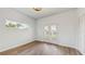 Spacious bedroom with vinyl plank flooring and French doors leading to backyard at 223 Stanley Ave, Frostproof, FL 33843