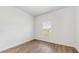 Bright bedroom with wood-look floors and a window at 223 Stanley Ave, Frostproof, FL 33843