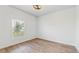 Spacious bedroom with wood-look floors and a window at 223 Stanley Ave, Frostproof, FL 33843
