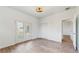 Bedroom with backyard access and wood-look floors at 223 Stanley Ave, Frostproof, FL 33843