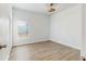 Bedroom with wood-look floors and a window at 223 Stanley Ave, Frostproof, FL 33843