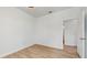 Simple bedroom with wood-look floors and a window at 223 Stanley Ave, Frostproof, FL 33843
