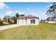 Newly constructed single story home with attached garage and well-manicured lawn at 223 Stanley Ave, Frostproof, FL 33843