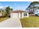 Newly constructed single story home with attached garage and well-manicured lawn at 223 Stanley Ave, Frostproof, FL 33843