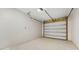 Empty garage with overhead door and ample space at 223 Stanley Ave, Frostproof, FL 33843