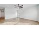 Bright and airy living room with vinyl plank flooring and ceiling fan at 223 Stanley Ave, Frostproof, FL 33843