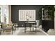 Home office with a desk, two armchairs, and a modern shelving unit at 502 Puma Loop, Groveland, FL 34736