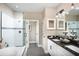 Spa-like bathroom with soaking tub, walk-in shower, and double vanity at 5721 Gingham Dr, Kissimmee, FL 34758