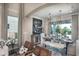 Bright dining area with farmhouse-style table, bench, and chandelier at 5721 Gingham Dr, Kissimmee, FL 34758