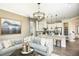 Living room with sectional sofa and view into kitchen area at 5721 Gingham Dr, Kissimmee, FL 34758