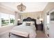 Spacious main bedroom with plush bed and sitting area at 5721 Gingham Dr, Kissimmee, FL 34758