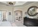 Main bedroom with large mirror and sitting area with two armchairs at 5721 Gingham Dr, Kissimmee, FL 34758