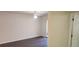 Bright bedroom with dark wood floors and access to a balcony at 713 Crest Pines Dr # 236, Orlando, FL 32828