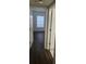 Bedroom with dark wood floors and a window with blinds at 713 Crest Pines Dr # 236, Orlando, FL 32828