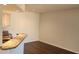 Kitchen with a breakfast bar and dark wood floors at 713 Crest Pines Dr # 236, Orlando, FL 32828