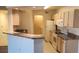 Well-equipped kitchen featuring granite countertops and white appliances at 713 Crest Pines Dr # 236, Orlando, FL 32828