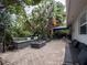 Landscaped backyard with seating and fire pit at 1400 S Pennsylvania Ave, Winter Park, FL 32789
