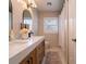 Light and bright bathroom with double vanity and a walk-in shower at 1400 S Pennsylvania Ave, Winter Park, FL 32789
