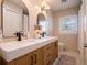 Bathroom with double vanity, modern lighting, and a neutral color palette at 1400 S Pennsylvania Ave, Winter Park, FL 32789