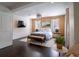 Serene bedroom with wood wall accents and dark floors at 1400 S Pennsylvania Ave, Winter Park, FL 32789