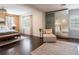 Spacious bedroom with dark hardwood floors and sitting area at 1400 S Pennsylvania Ave, Winter Park, FL 32789