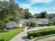 Attractive single-story home with a landscaped yard and paver driveway at 1400 S Pennsylvania Ave, Winter Park, FL 32789