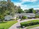 Single-story home with brick paver driveway and beautifully landscaped yard at 1400 S Pennsylvania Ave, Winter Park, FL 32789