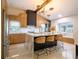 Modern kitchen with marble countertops, wooden cabinets, and a large island at 1400 S Pennsylvania Ave, Winter Park, FL 32789