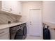 Spacious laundry room with modern washer and dryer at 1400 S Pennsylvania Ave, Winter Park, FL 32789