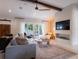 Bright living room features a cozy seating area and a large TV at 1400 S Pennsylvania Ave, Winter Park, FL 32789