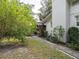 Landscaped side yard with brick pathway at 1400 S Pennsylvania Ave, Winter Park, FL 32789